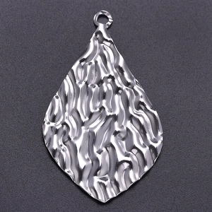 Close-up of a 304 stainless steel oval water ripple textured pendant with a silver finish