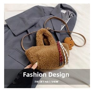 Close-up of brown lamb wool bucket bag with cute bear charm and woven rope detail