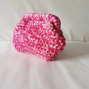 Detailed view of handmade pink woven cloud bag showing thick fabric thread texture