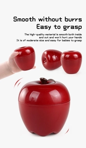 Macro detail of red apple toy showing smooth edges and easy-to-grasp size for infants