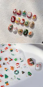 Detail of 3D embossed Christmas nail stickers with Santa Claus and reindeer designs