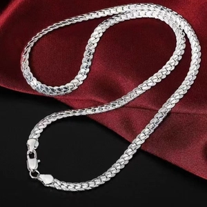 Elegant silver-plated flat curb chain necklace with lobster clasp on red velvet