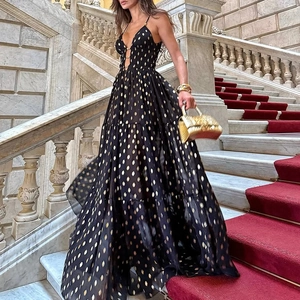 Deep V-neck black long dress with gold metallic polka dots and elegant tiered skirt
