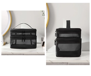 Dual-layer black mesh toiletry bag with zipper and handle on a marble surface