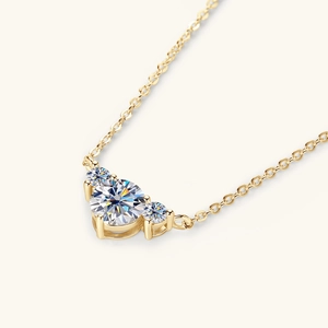 Elegant 18K gold heart-shaped Moissanite necklace with three brilliant round-cut stones
