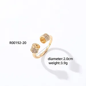 Detailed close-up of a gold-plated open ring with micro-pave zircons and spiral texture