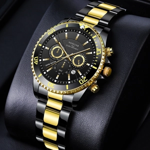 Detail shot of the black and gold quartz watch dial with chronograph and date display