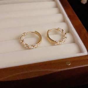 Baroque mini pearl C-shape hoop earrings with twisted gold wire in a luxury jewelry box