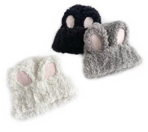 Close-up of soft faux fur knit hats with bunny ears in black, grey, and cream white