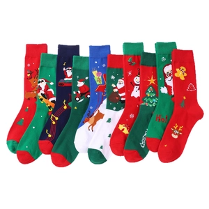 Set of 5 pairs of festive Christmas mid-calf socks with various holiday patterns on white background