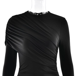 Close-up detail of the diagonal pleated design and ruching on this black slim dress