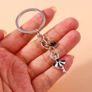 Ballerina girl keychain with crown pendant on hand for bag charm decoration