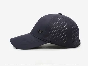 Detail of laser-cut ventilation holes and metal SPORTS badge on quick-dry baseball cap