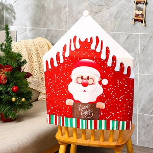 Detail of Christmas chair cover with Santa print and Warm Wishes text in cozy home setting
