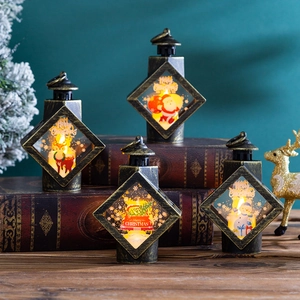 Set of four vintage Christmas lanterns with LED candles on antique books decor
