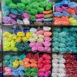 Bulk colorful clay beads for DIY jewelry making stored in transparent bags on shelves