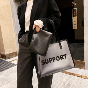 Minimalist clear PVC tote bag with black leather inner pouch and Support text print
