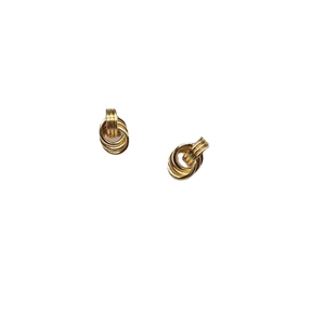 Elegant gold spiral intertwined earrings with minimalist metal texture on white background