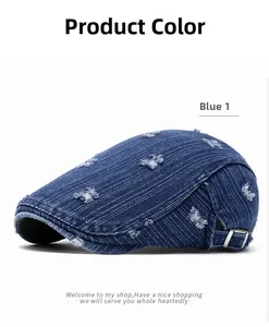 Detail view of distressed blue denim newsboy hat with adjustable metal side buckle
