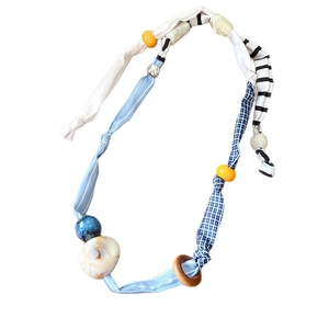 Ethnic fabric heart pendant necklace with blue cotton ribbon and resin beads