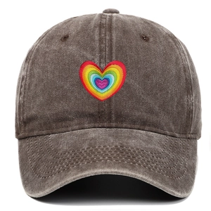 Detail of embroidered rainbow heart on vintage washed cotton baseball cap