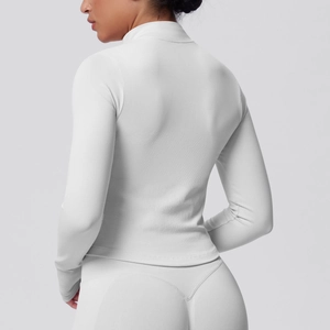 Detailed back view of white seamless compression yoga set with breathable honeycomb texture