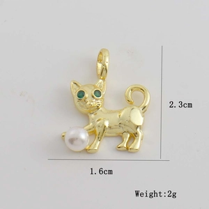 Detailed view of cat pendant dimensions 2.3cm by 1.6cm with white pearl and green eyes