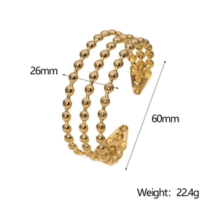 Detailed size chart of a multi-layer gold cuff bracelet with width and weight measurements
