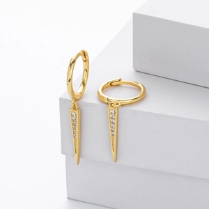 Detailed close-up of gold s925 hoop earrings with clear zircon stones on cone charms