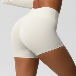 Detail view of high waisted ivory yoga shorts featuring 3D peach hip lifting seams
