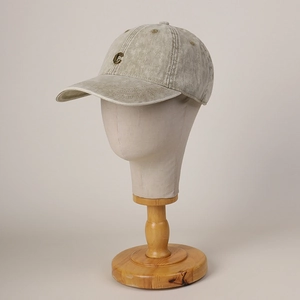 Vintage washed cotton baseball cap with metal C logo on a neutral display stand