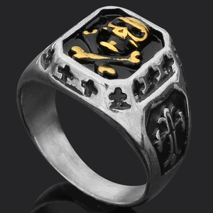 Detail of Viking Thor hammer ring with golden skull crest and cross engraving