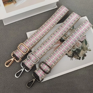 Adjustable woven shoulder strap for handbags with geometric pattern and metal hardware