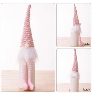 Three-sided view of pink knit Christmas gnome with long striped legs and white beard