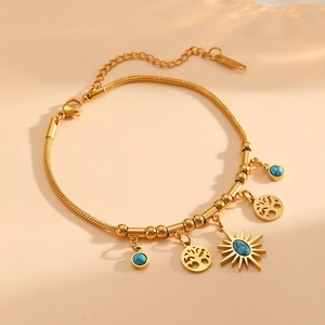 Gold stainless steel snake chain bracelet with turquoise tree of life and star charms