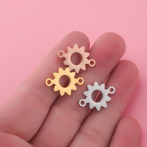 Polished stainless steel sunflower charm connectors in gold and rose gold for DIY jewelry