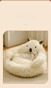 Detail of soft plush alpaca cat bed showing cozy semi-enclosed texture and warmth