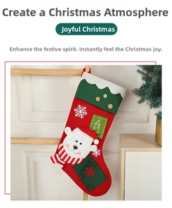 Hanging Christmas stocking featuring 3D polar bear and embroidered snowflake detail