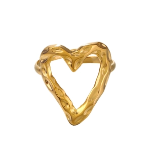 Irregular heart-shaped gold ring with hammered texture on a clean white background