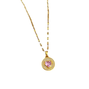 Collier en titane doré avec pierre rose en forme de cœur et pendentif en cristaux