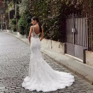 White lace mermaid wedding dress with open back, spaghetti straps and elegant long train