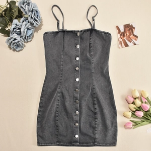 Close-up of washed gray denim mini dress with metal buttons and slim shoulder straps