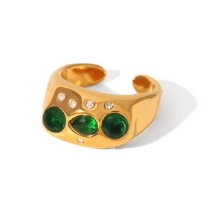 Detail of gold-plated stainless steel ring with green zircon stones and hammered texture