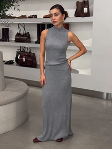 Elegant grey ribbed knit sleeveless maxi dress set for women in a fashion showroom
