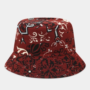Detailed pattern of deep red bucket hat with black and white abstract ripple prints