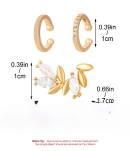 Detailed view of gold alloy ear cuff set with leaf motifs and sparkling cubic zirconia