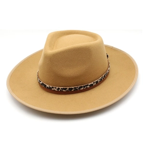 Detail of camel wool fedora hat with a stylish leopard print band and wide flat brim