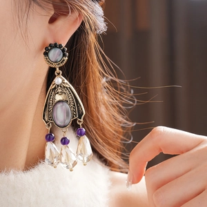 Detail of vintage flower tassel earrings with crystals and grey mother of pearl