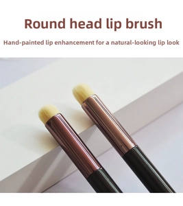 Macro view of round silicone lip brushes with rose gold ferrules and black handles
