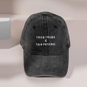 Vintage washed black denim baseball cap with white THICK embroidered text for casual street style